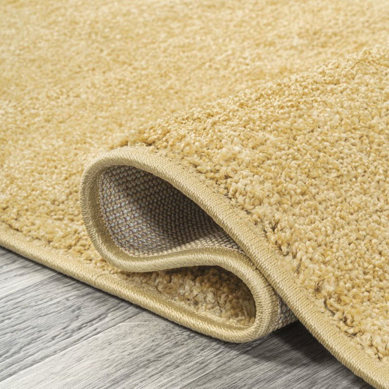 Asako Solid Low-Pile Mustard Rug, Oval 4' x 6'