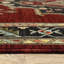Tapis oriental rouge et noir tissé à la machine avec franges