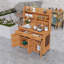 Banc de rempotage d'extérieur en bois de sapin avec beaucoup de rangement, tablettes réglables, crochets et roulettes verrouillables-915549094