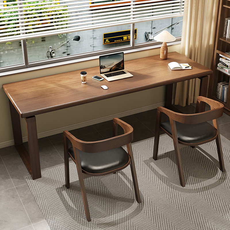 A simple rectangular solid wood desk in walnut color, 29.53" H x 62.99" W x 23.62" D