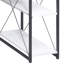 Bureau blanc et noir avec de nombreuses tablettes pour écrire