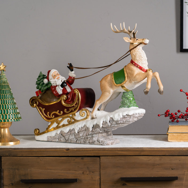 Résine père Noël en traîneau avec cerf