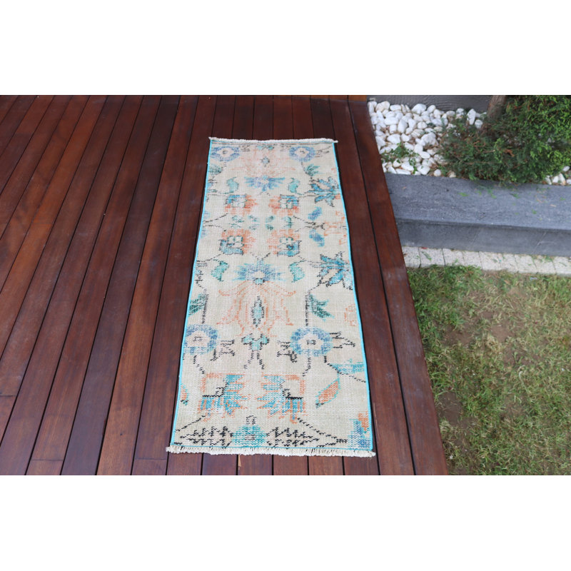 Vintage Turkish Door Mat Featuring A Handmade Wool Rug With Soft Pastel Tones And An Exquisite Floral Design
