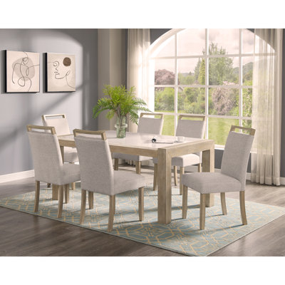 Ensemble de salle à manger de style contemporain avec table rectangulaire blanche et chaises rembourrées