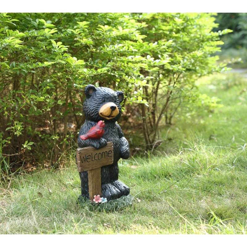 Statue de jardin ours tenant une pancarte de bienvenue