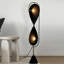 Métaux noirs + lampes sur pied de forme libre Fabri