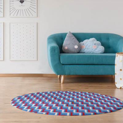 Tapis rond bleu / rouge à motif géométrique