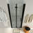 34 to 35-1/2 in. W x 72 in. H Bi-Fold Frameless Shower Doors in Black with Clear Glass