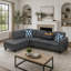 Canapé d'angle en L gris anthracite avec console porte-gobelets, pouf de rangement et coussins décoratifs.