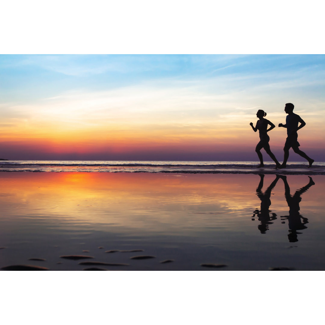 Leinwandbild Two Runners On The Beach, Silhouette