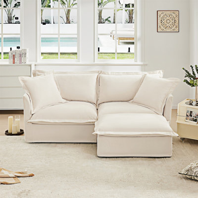 Canapé en tissu avec repose-pieds convertible