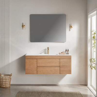 Meuble-lavabo simple mural et flottant avec lavabo en céramique, parfait pour les salles de bain modernes et peu encombrant.