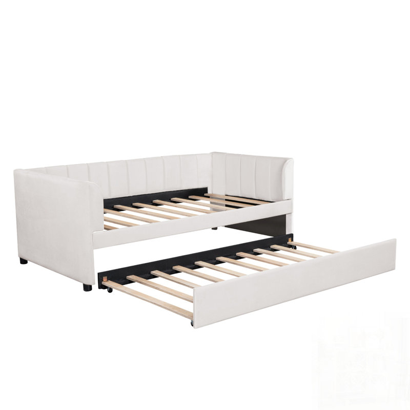 Lit de jour simple rembourré avec dossier ergonomique et lit gigogne peu encombrant, parfait pour les petits appartements et les soirées pyjama.