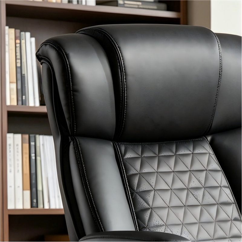 This executive-grade ergonomic leather office chair features a widened seat, foldable armrests, and adjustable lumbar support. It has a weight capacity of 500 pounds and is made of breathable leather with silent casters.