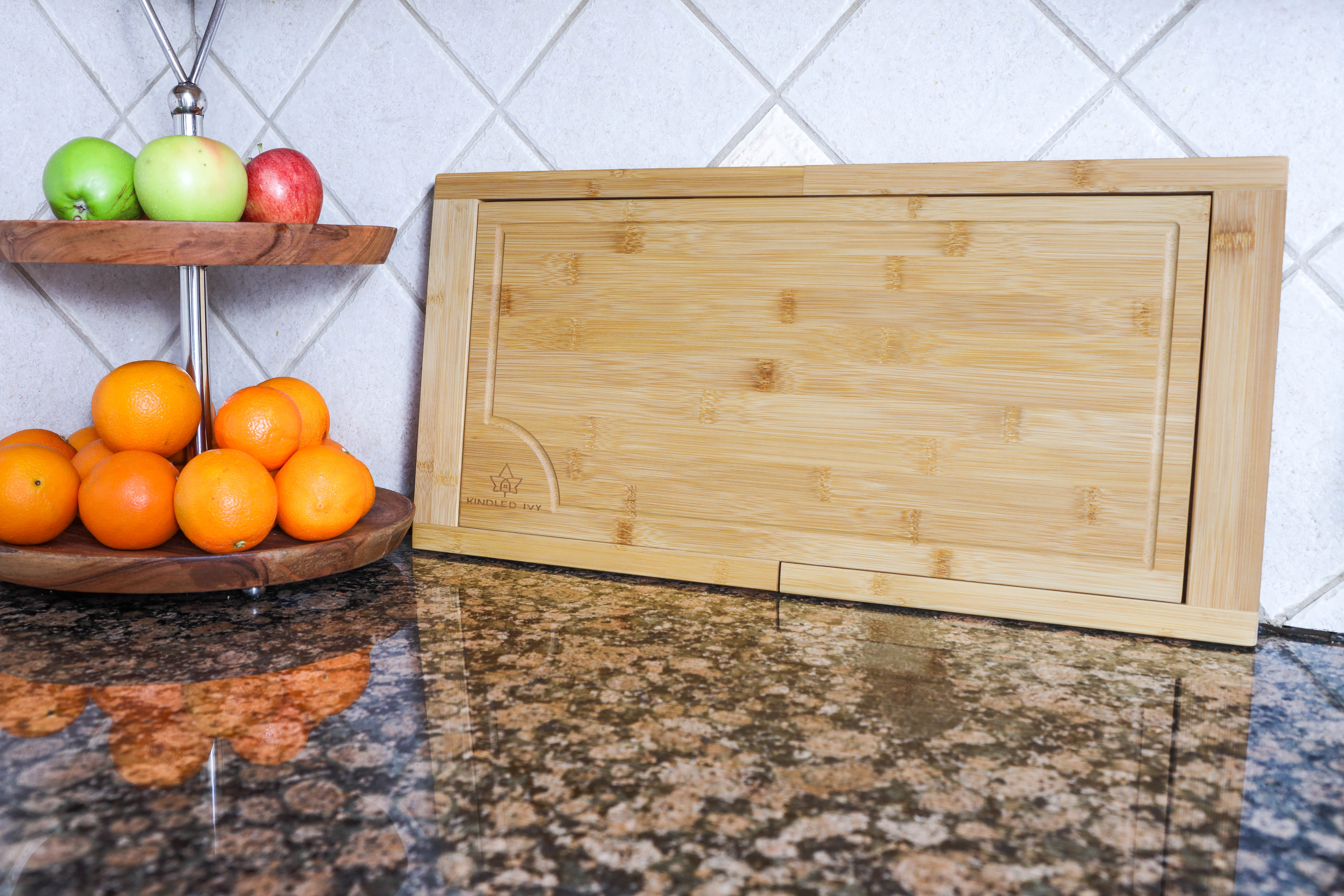 https://assets.wfcdn.com/im/96179195/compr-r85/2380/238034643/expandable-over-the-sink-bamboo-cutting-board.jpg