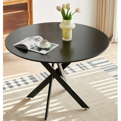 Table de salle à manger ronde avec pieds en métal et verre trempé