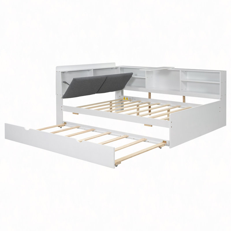 Lit plateforme en bois avec lit gigogne, tablettes et tête de lit
