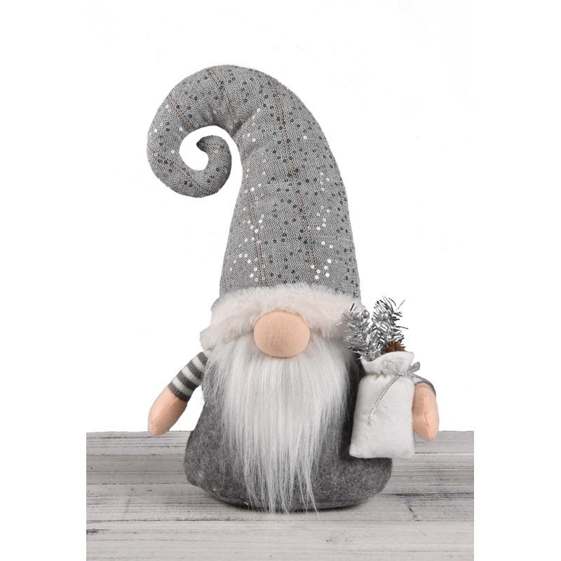 Figurine gnome debout portant un sac-cadeau