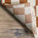 Dominique Abstract Checkered Fringe Area Rug