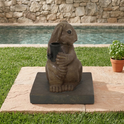 Base conçue avec un motif de lapin destiné à accueillir un parasol