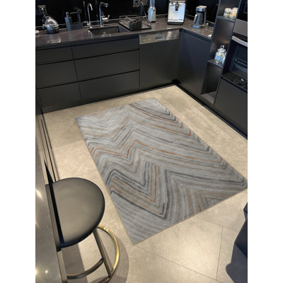 Tapis décoratif beige à motif géométrique abstrait multicolore
