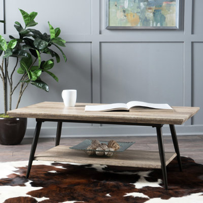 Table basse moderne grise avec tablette de rangement spacieuse et polyvalente pour l'organisation du salon