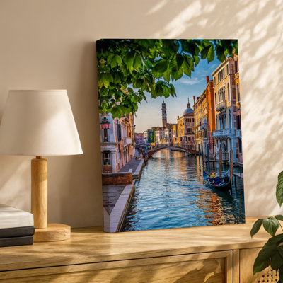 Canvas A Picturesque Scene Of Venice Italy Featuring A Tranquil Canal Wall Art Flanked By Historic Buildings With Vibrant Orange And Canvas Wall Art