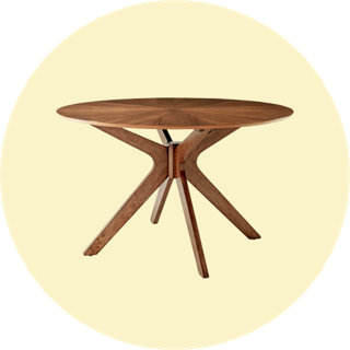 Table à manger ronde moderne en noyer avec pieds sculptés