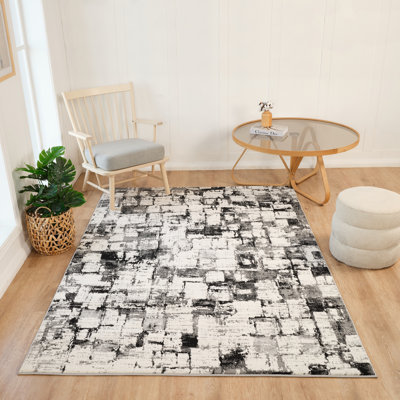 Tapis os / noir à motif abstrait transitionnel de la collection olliah