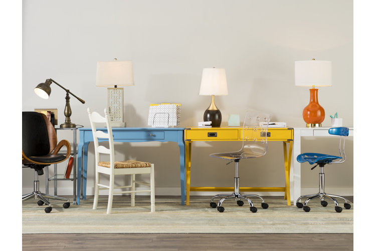 row of desks with task lamps