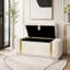 Banc de rangement moderne avec repose-pieds en velours et détails en métal doré-530555767