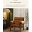 Cette chaise décorative en cuir ciré à l'huile de style ancien, avec une structure en bois, convient à une utilisation dans le salon.