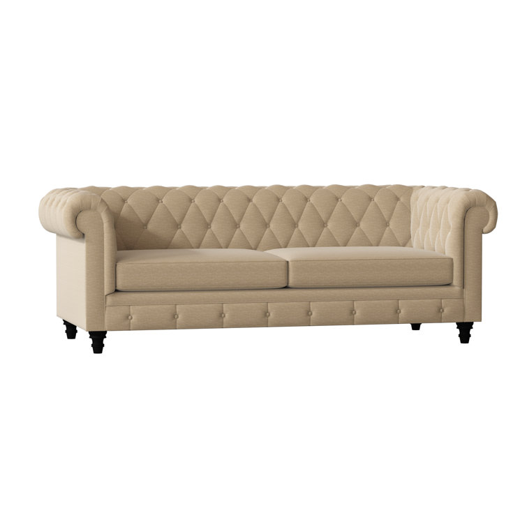Canapé Chesterfield à accoudoirs roulés