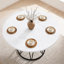 Une table de salle à manger circulaire d'un diamètre de 47,3 pouces, composée de 4 panneaux de fibres à densité moyenne à motif de marbre blanc, de supports en métal en forme de sablier et d'une table à manger de style industriel moderne pour 4 à 6 personnes.-129620586