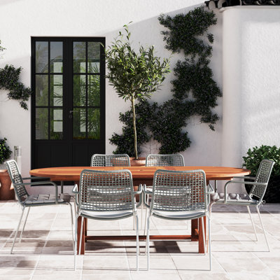 Anautica 6 - Person Patio Dining Set Extendable and Umbrella Hole Included Oval Table with Cushions Included