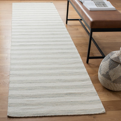 Tapis rayé en laine / coton tissé à la main Waukena bleu clair / ivoire