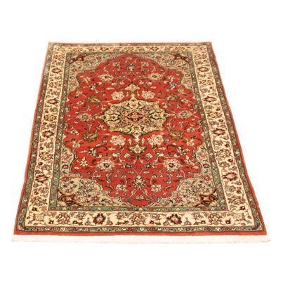 Splendid piece of work that is woven in Turkey with a re-interpretation of village Persian designs. The vintage and distressed look make this hand-knotted wool rug a natural standout.