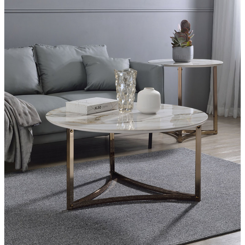 Table basse ronde en fritté avec plateau en pierre et champagne