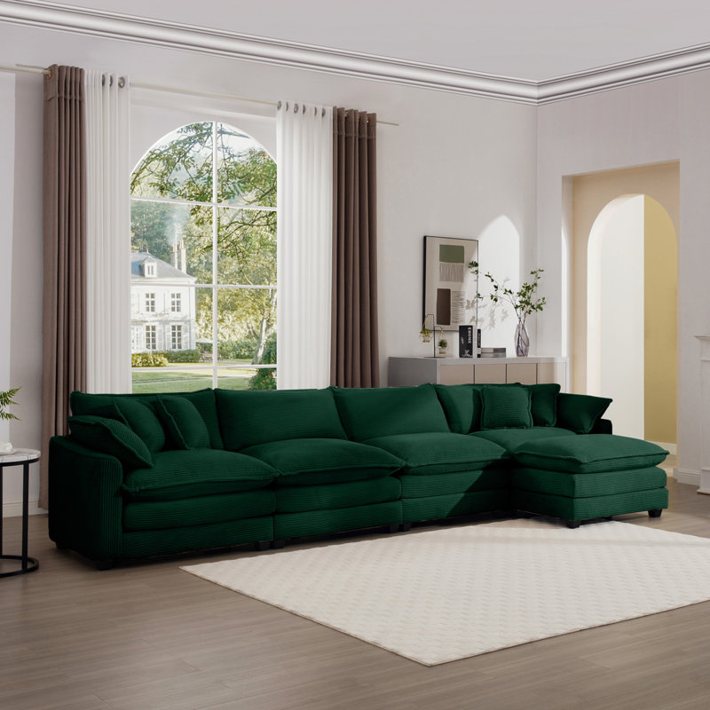 Canapé confortable en velours côtelé avec plusieurs coussins et un design élégant pour divers espaces, Vert