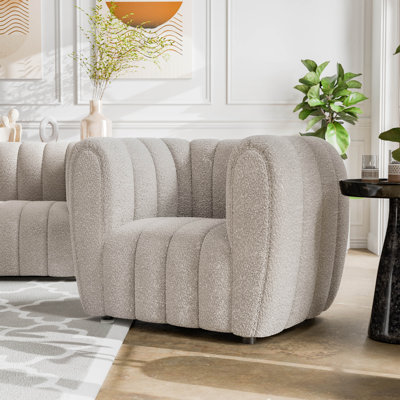 Fauteuil demi-tonneau capitonné Celal Channel