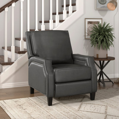 Fauteuil inclinable, dossier transitionnel, structure en bois massif avec pieds noirs inclinables dans le salon, base
