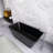 67 Inch Freestanding Solid Surface Soaking Bathtub， Black