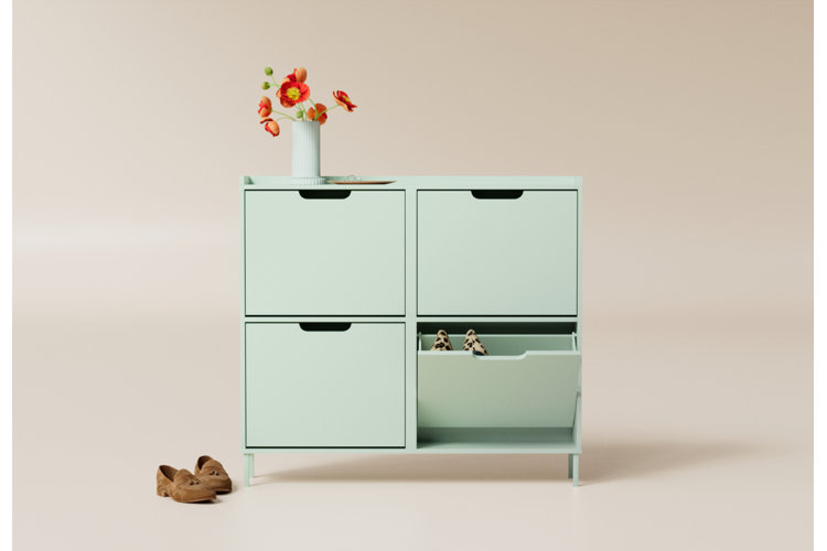 mint green shoe storage cabinet with brown suede loafers and cheetah-print ballet flats