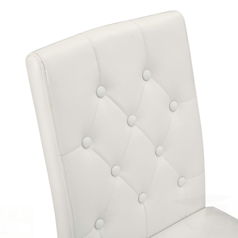 Chaises de salle à manger en polyuréthane avec dossier ergonomique à boucle, pieds en métal doré, alliant confort et texture pour une élégance moderne.
