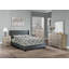 Grand lit contemporain avec tête de lit capitonnée à losanges, garniture cloutée