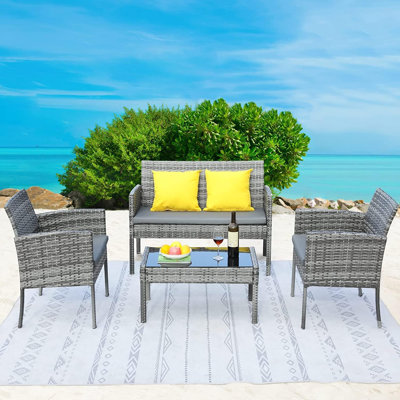 Andricka 4 - Person Patio Dining Set Rectangular Table with Cushions Included