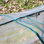 Mini serre Outsunny 11 pi x 3 pi x 2,5 pi, serre portative à tunnel avec portes à fermeture à glissière, housse imperméable aux rayons UV, structure en acier