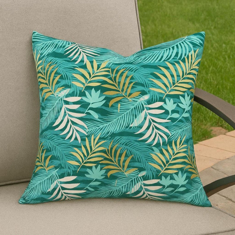 Coussin d'extérieur turquoise à motif de feuilles tropicales