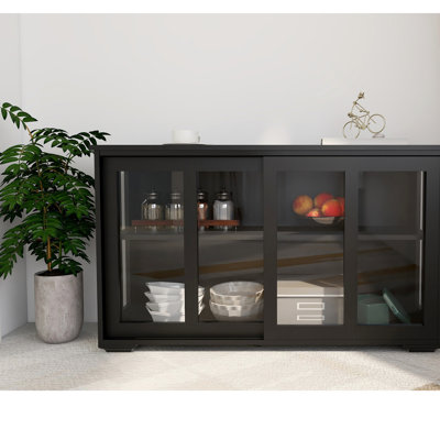 Kitchen Storage Cabinet With Glass Door - Black. E1 Grade Board Ensures Stability. Two Sliding Doors And Adjustable Shelves For Maximum Storage. Non-Slip Base. Effortless Assembly Black Cupboard
