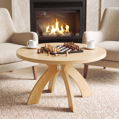 Table basse ronde moderne en bois avec pieds croisés courbés